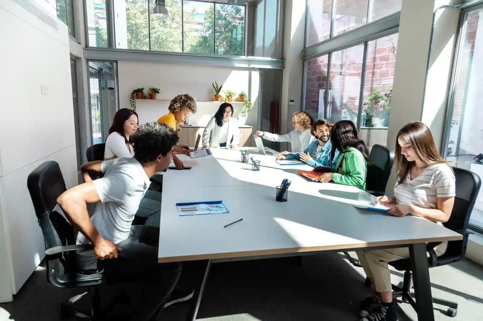 Students laughing and studying together in a library.